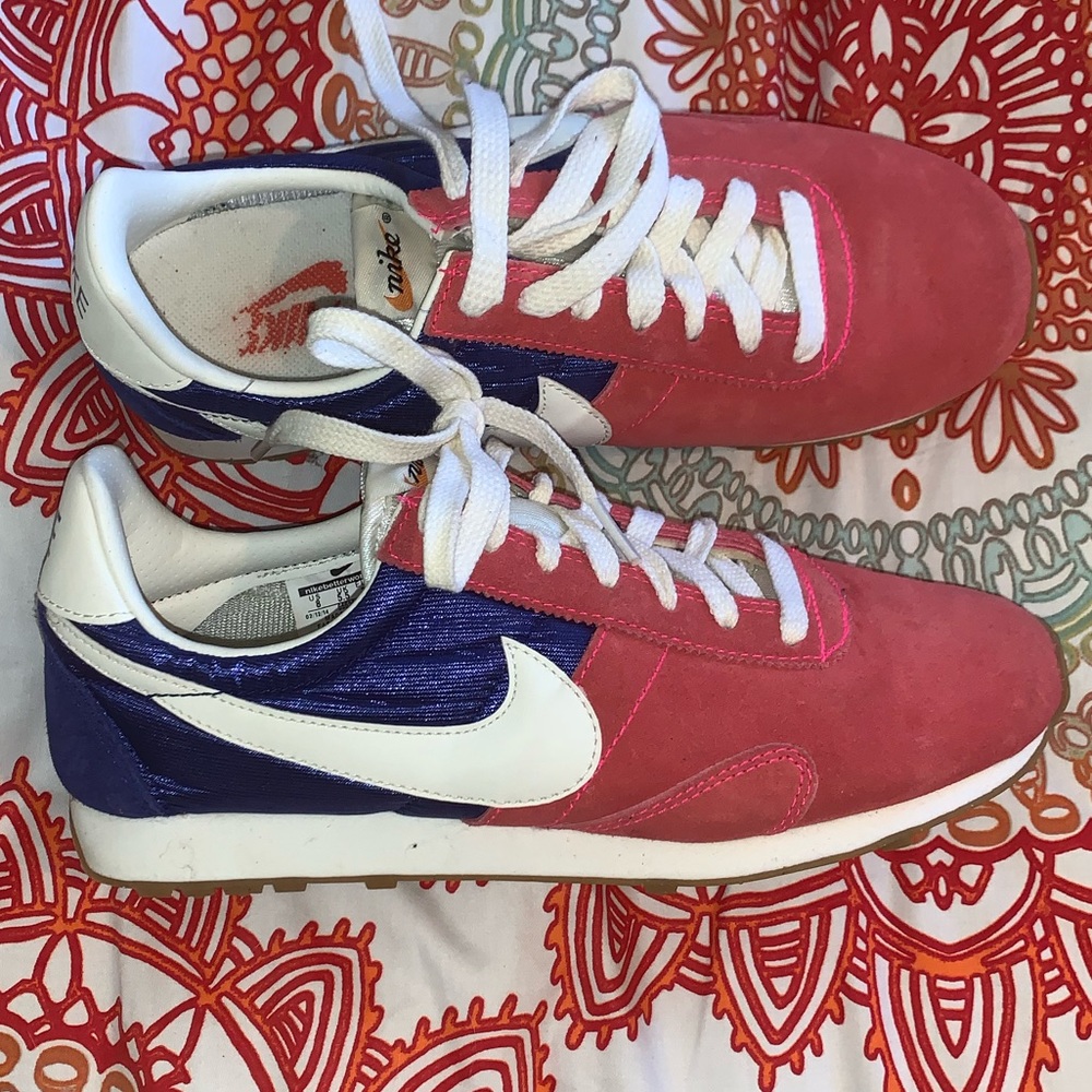 Red and Purple Nike shoes